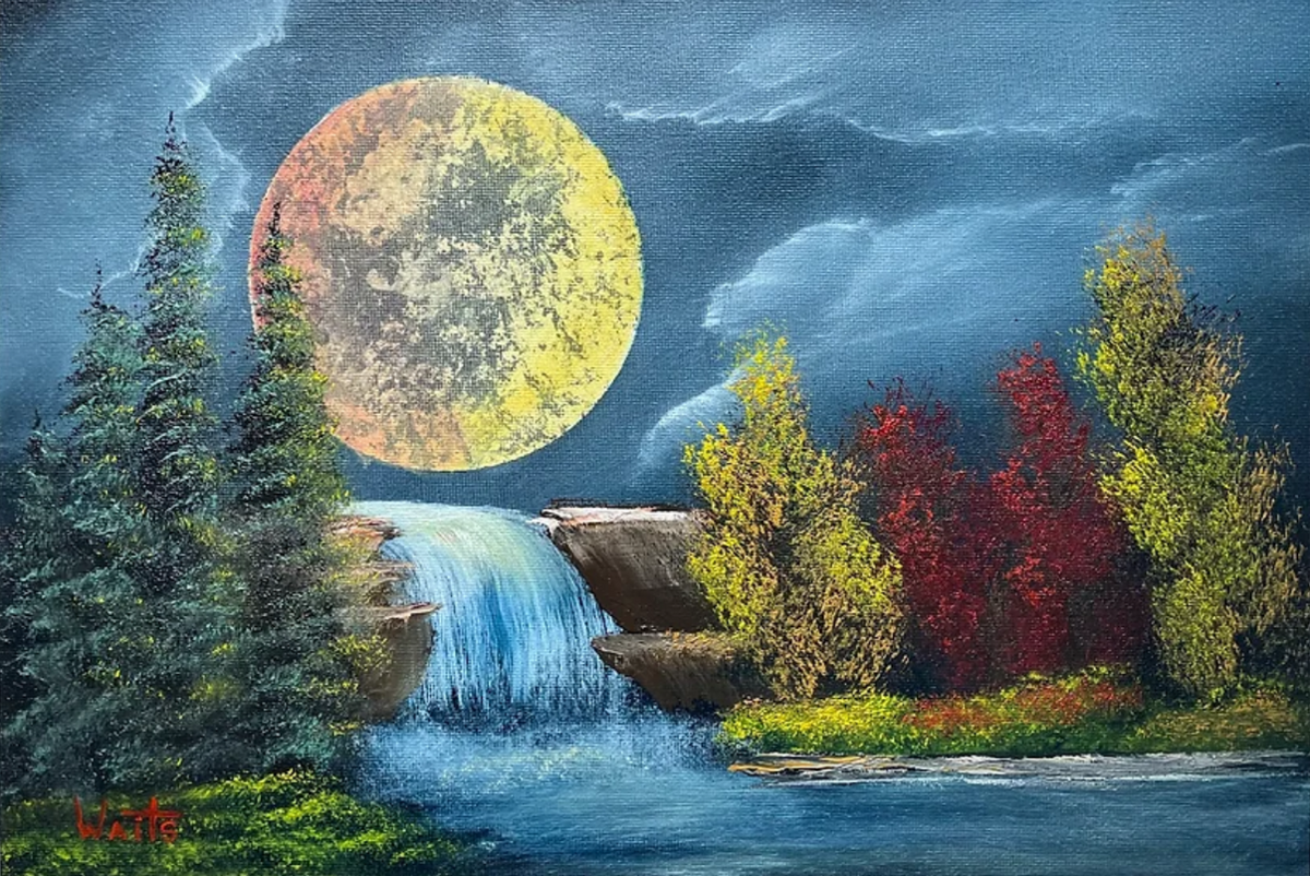 Moon over a waterfall with trees in the foreground.